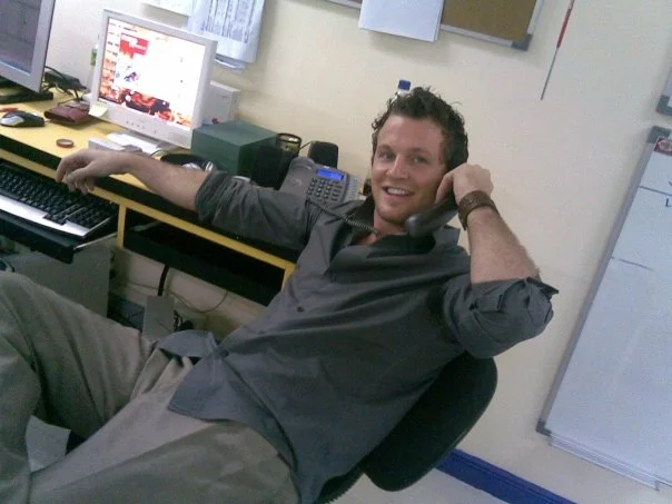 An archived photograph of Zack Williamson at work
